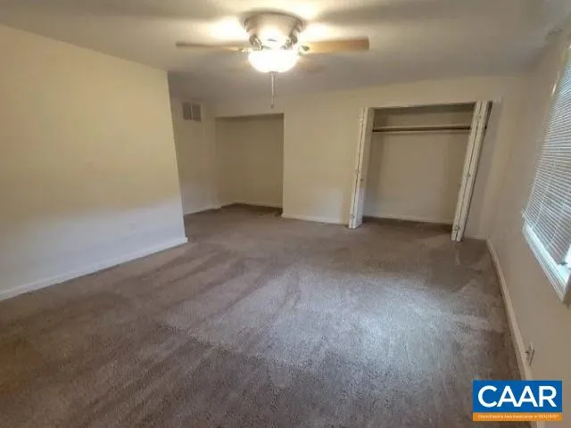 an empty room with a empty space and a window