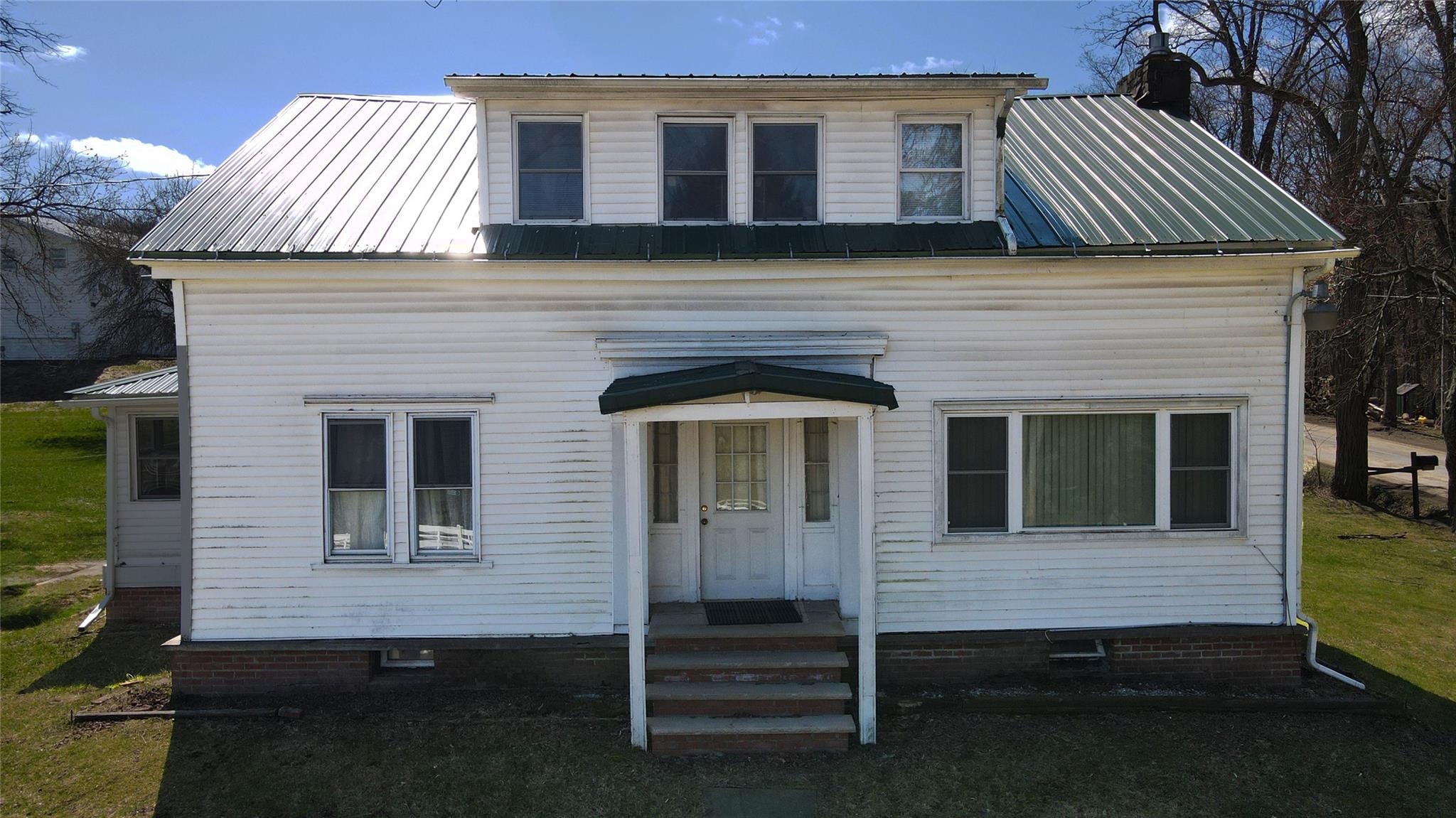 892 Bowbell Road Greene, NY 13778 - Photo 12 of 35 View of front facade featuring a metal roof, crawl space, and a chimney