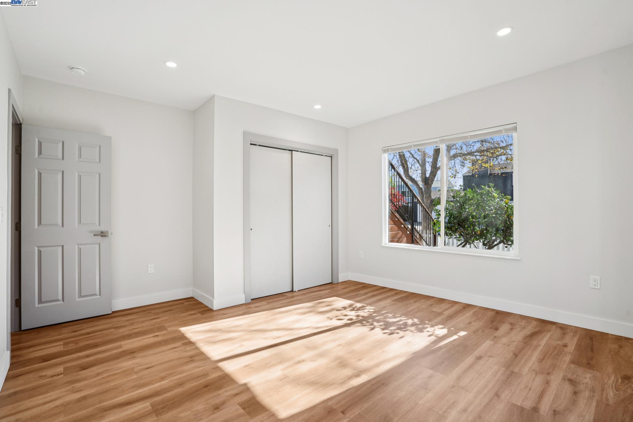 882 61st Street Oakland, CA 94608 - Photo 14 of 51 a view of a room with wooden floor and window