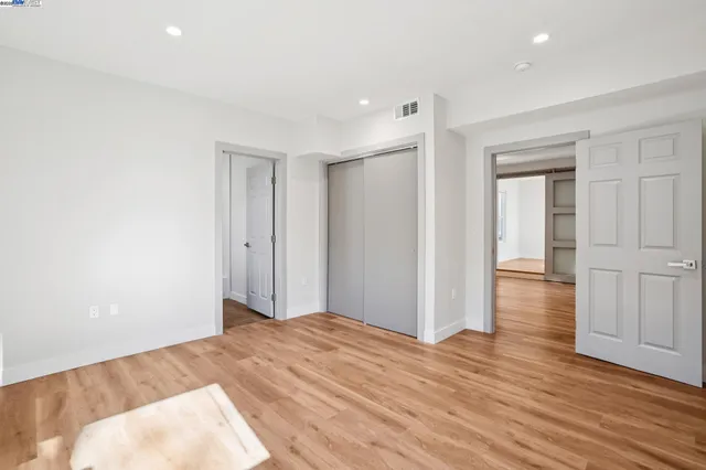 a view of a livingroom with wooden floor