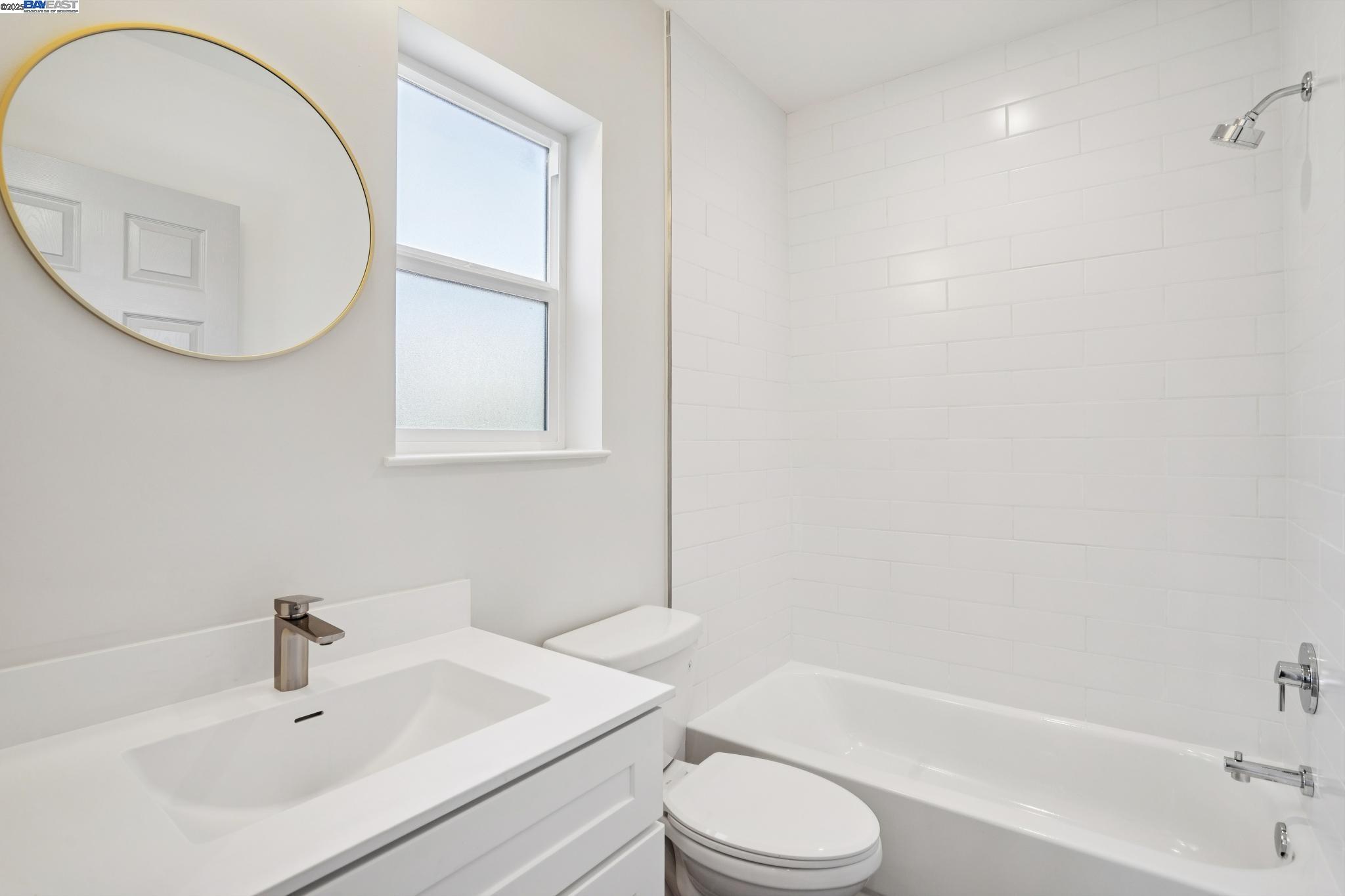 882 61st Street Oakland, CA 94608 - Photo 17 of 51 a bathroom with a sink toilet and a bathtub