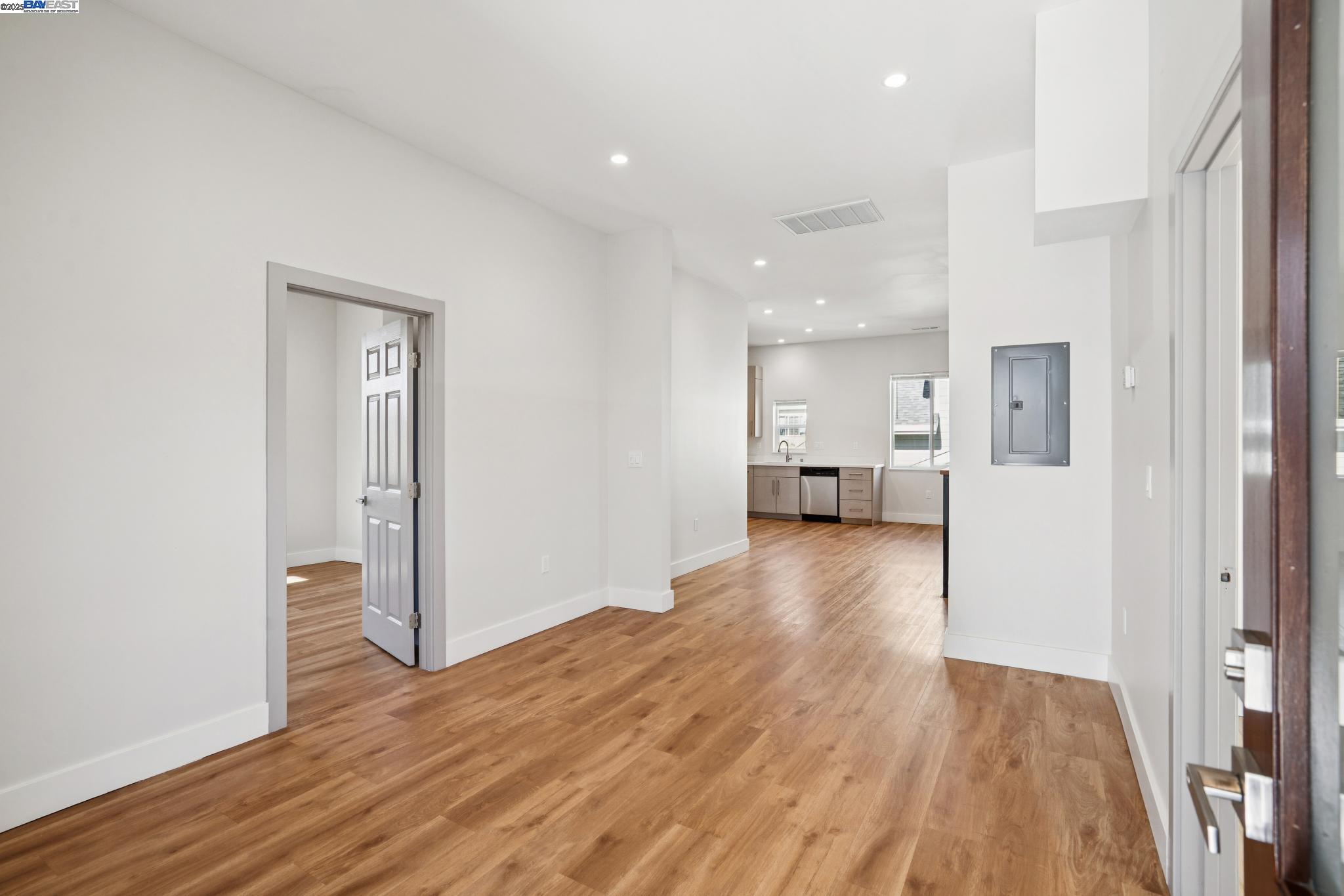 882 61st Street Oakland, CA 94608 - Photo 2 of 51 a view of a living room with wooden floor and a window