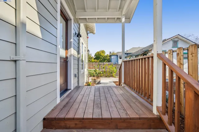 a view of backyard with wooden deck and wooden floor
