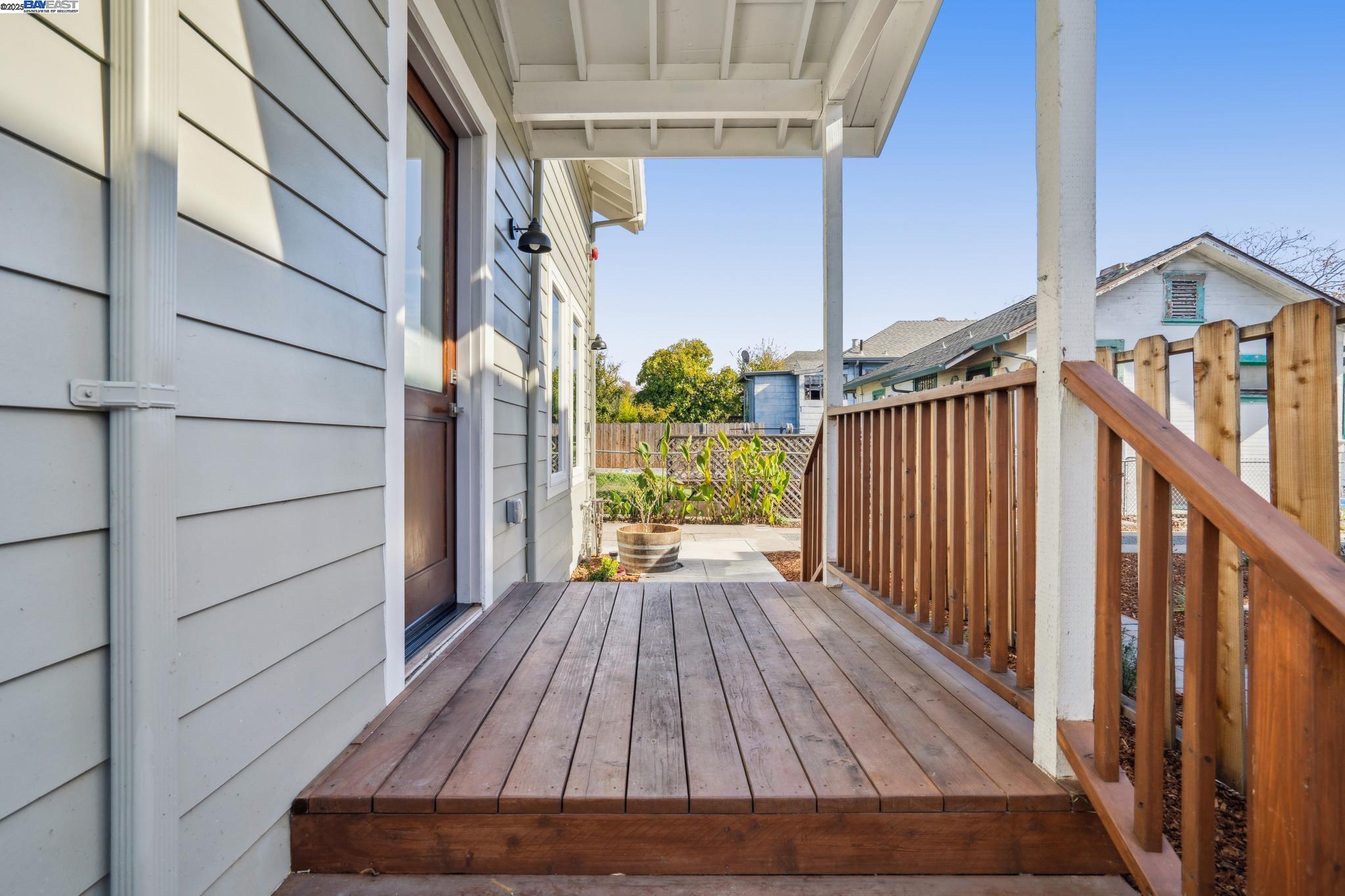 882 61st Street Oakland, CA 94608 - Photo 28 of 51 a view of backyard with wooden deck and wooden floor