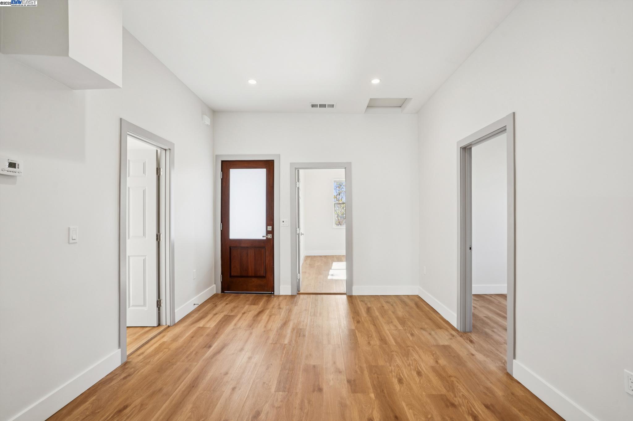 882 61st Street Oakland, CA 94608 - Photo 3 of 51 a view of an empty room with wooden floor