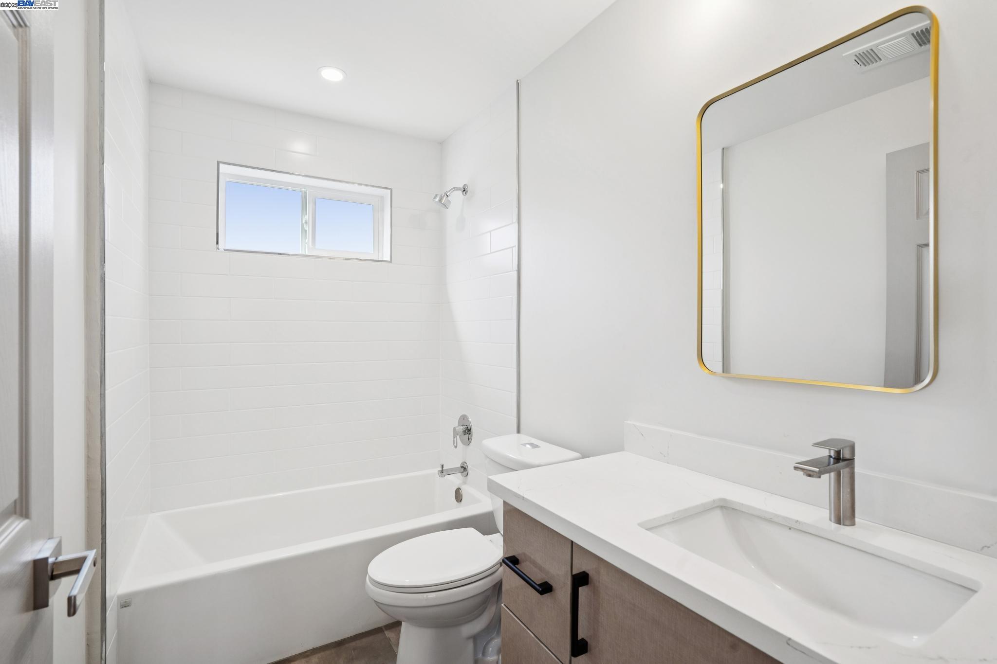 882 61st Street Oakland, CA 94608 - Photo 36 of 51 a bathroom with a sink toilet and shower