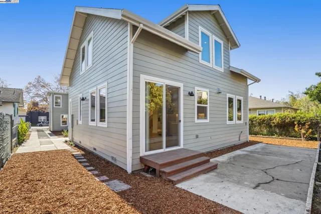 a view of a pathway of a house with a yard
