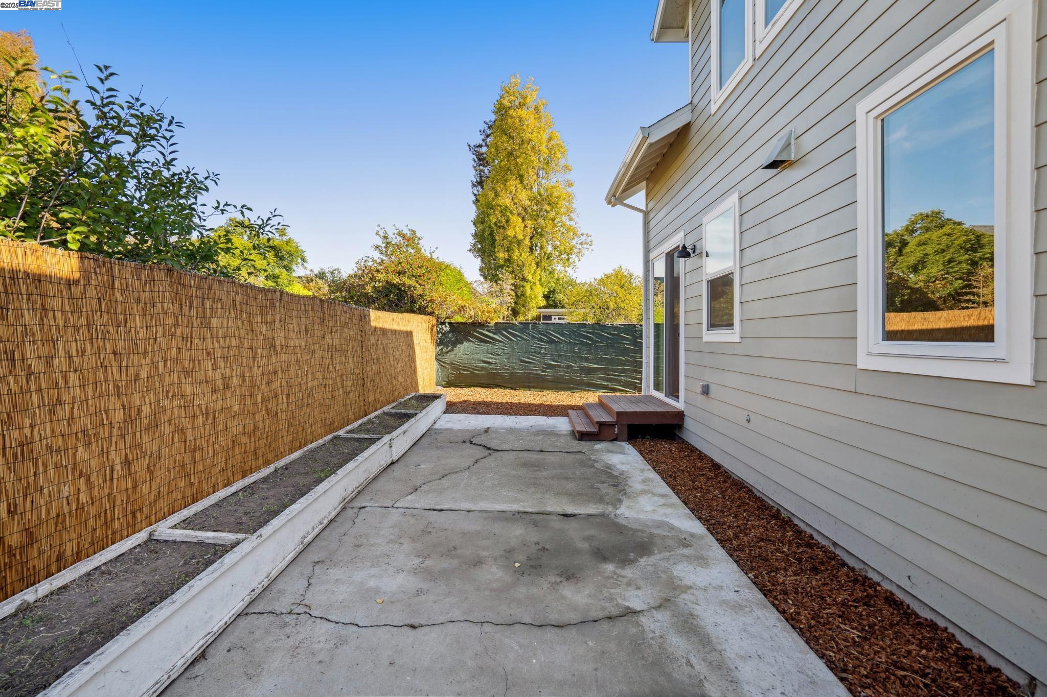 882 61st Street Oakland, CA 94608 - Photo 49 of 51 a view of a pathway of a house with a yard