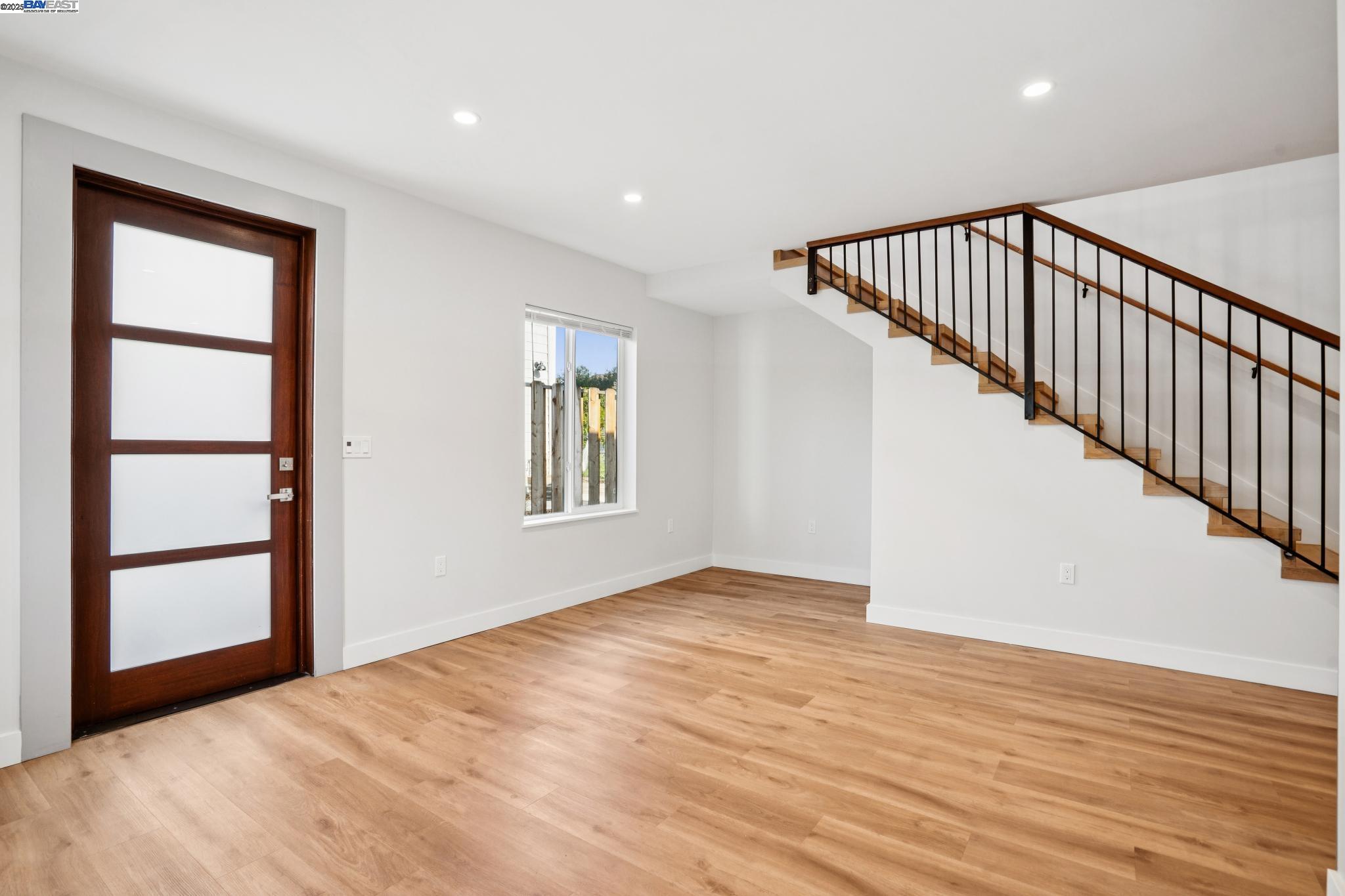 882 61st Street Oakland, CA 94608 - Photo 8 of 51 a view of an empty room with wooden floor and a window