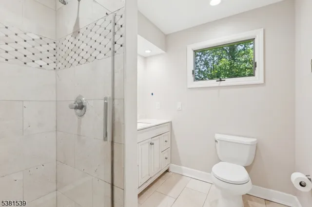 a bathroom with a toilet sink and shower
