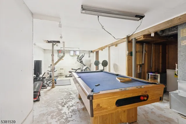 a bedroom with a bed and a table