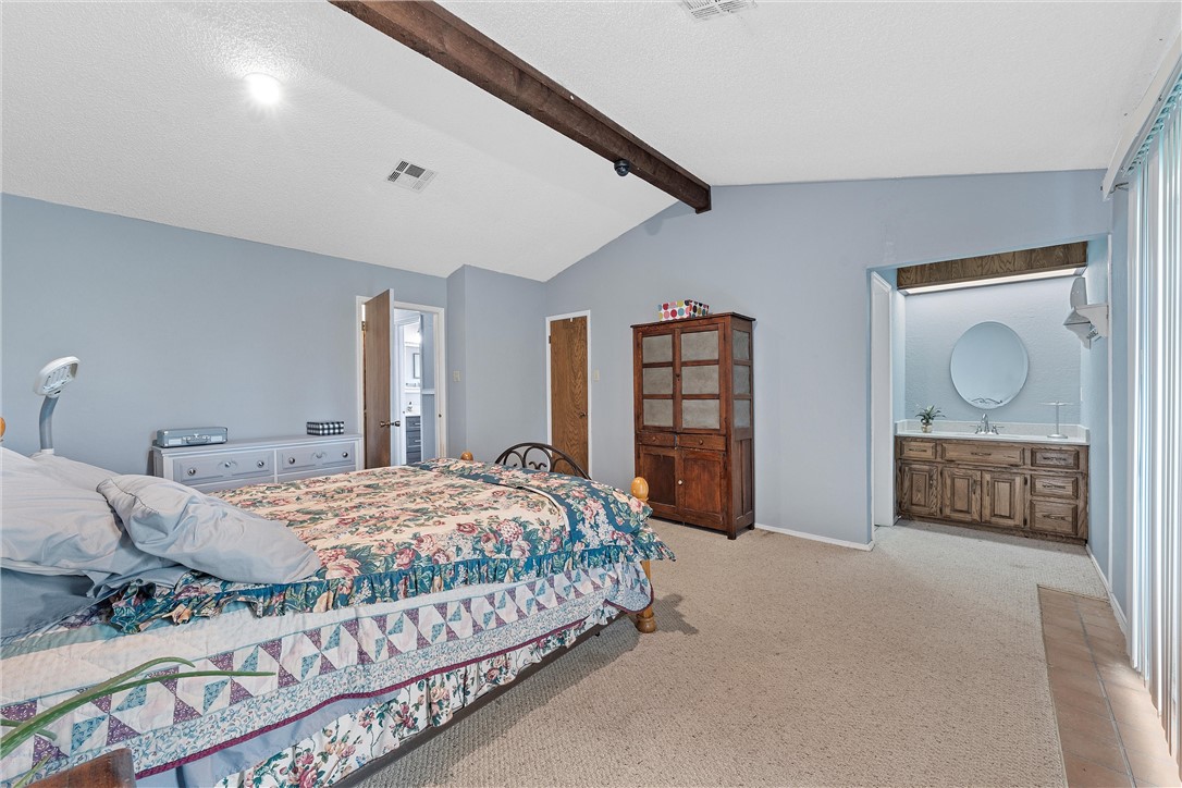 472 Coxs Oak Valley Road Waco, TX 76705 - Photo 13 of 47 a bedroom with bed and window