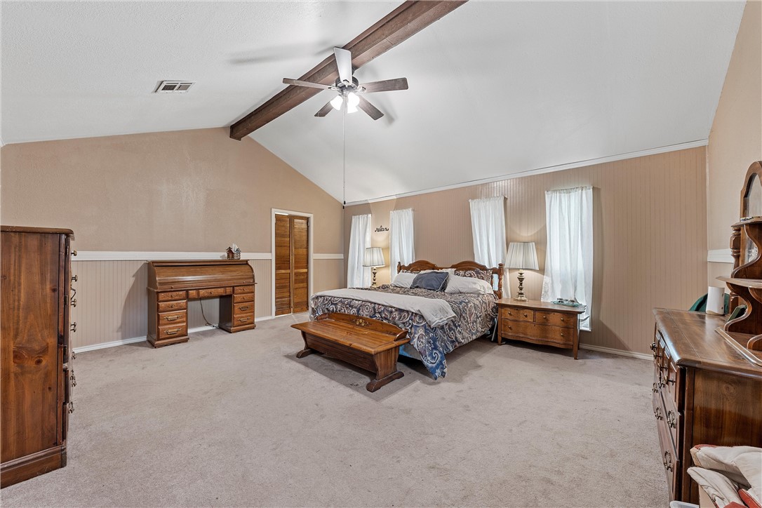 472 Coxs Oak Valley Road Waco, TX 76705 - Photo 20 of 47 a spacious bedroom with a bed and a couch