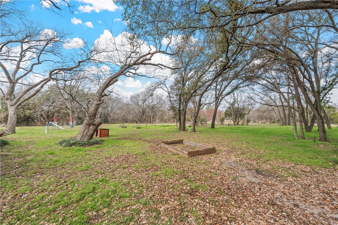 472 Coxs Oak Valley Road Waco, TX 76705 - Photo 35 of 47 a view of a tree in front of a house