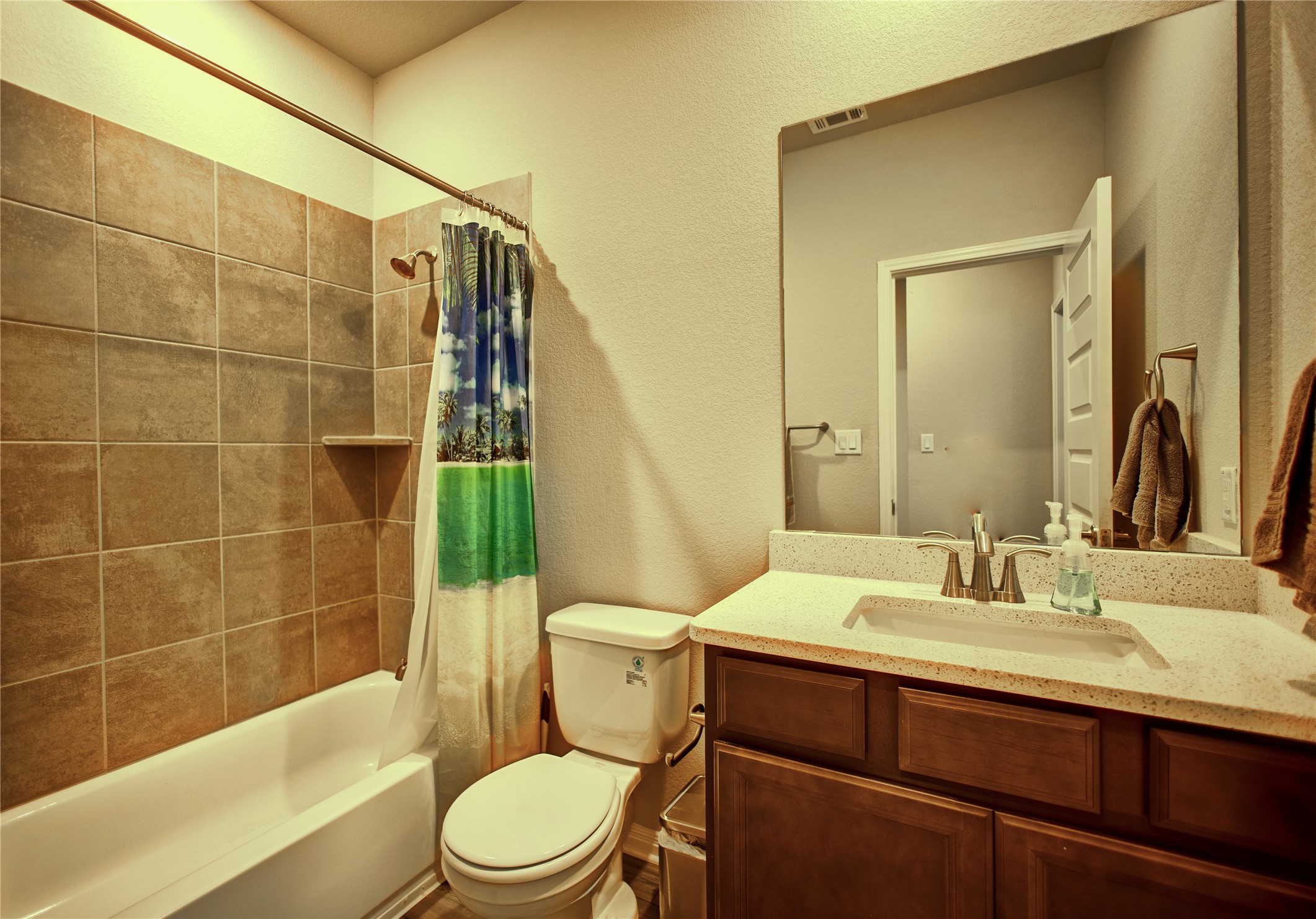 2809 Moyer Lane Round Rock, TX 78665 - Photo 11 of 22 Full bath featuring a textured wall, vanity, and shower / bathtub combination with curtain