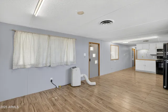 a view of an empty room with a window