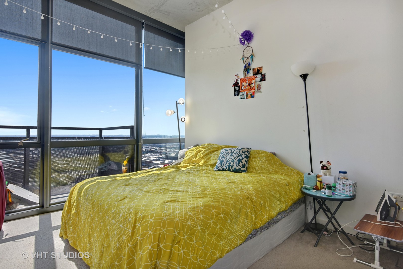 235 West Van Buren Street, Unit 3804 Chicago, IL 60607 - Photo 5 of 11 a bed sitting in a bedroom next to a window