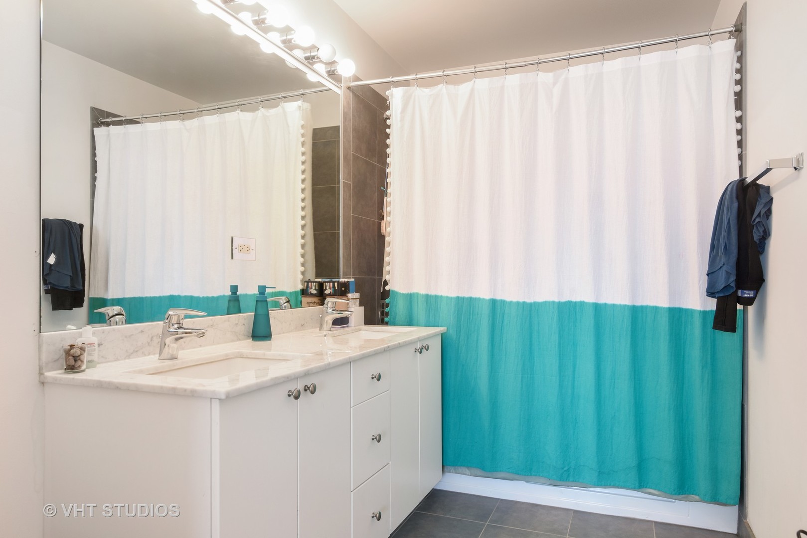 235 West Van Buren Street, Unit 3804 Chicago, IL 60607 - Photo 6 of 11 a bathroom with a double vanity sink and a mirror
