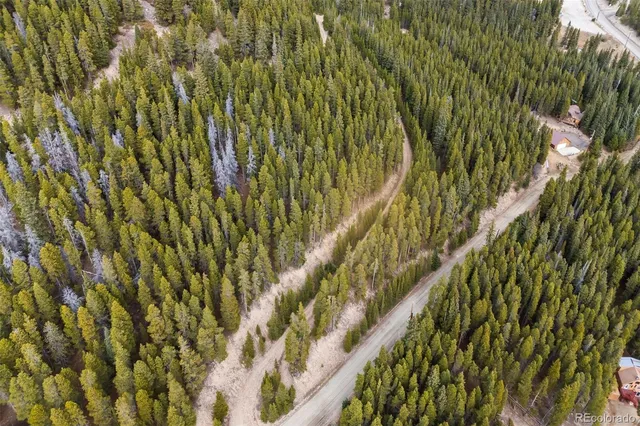 a view of a large mountain with mountains in the background