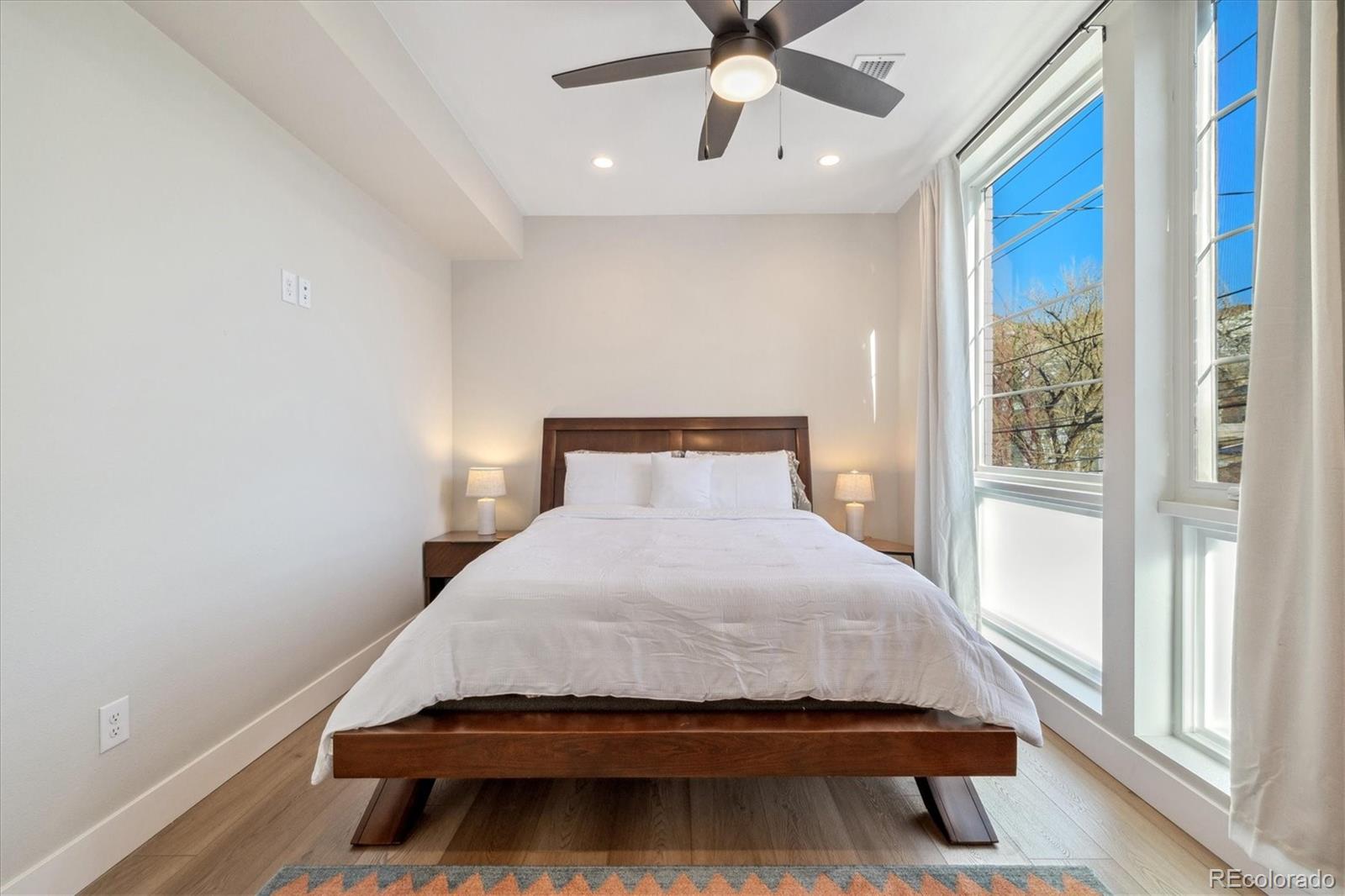 1401 Jackson Street, Unit 204 Golden, CO 80401 - Photo 18 of 26 a bedroom with a bed and window