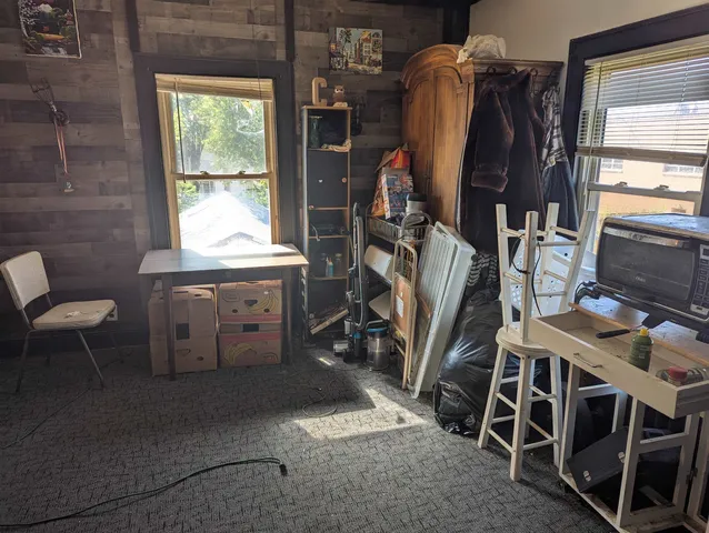 a bathroom with a black and white checkered floor