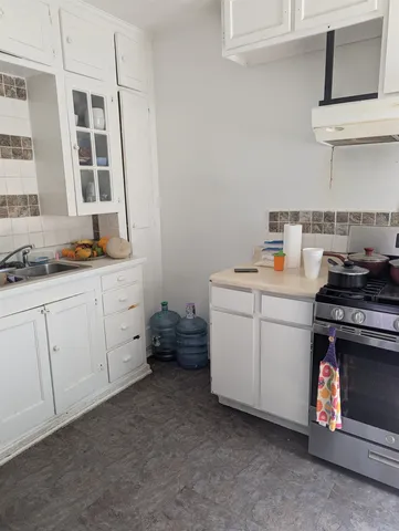 a utility room with cabinets dryer and washer