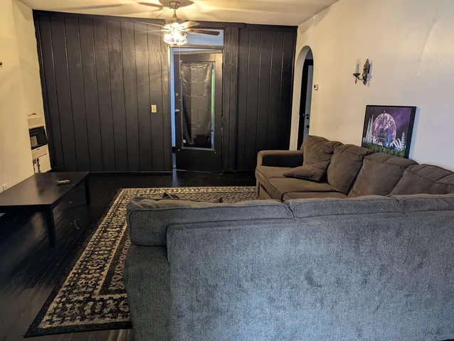 a living room with furniture and a rug