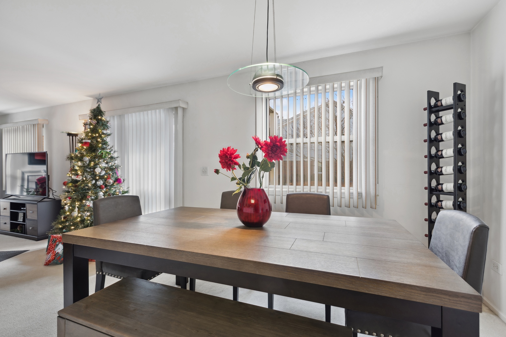 71 Larch Court, Unit B Schaumburg, IL 60193 - Photo 3 of 12 a view of a dining room with furniture and chandelier