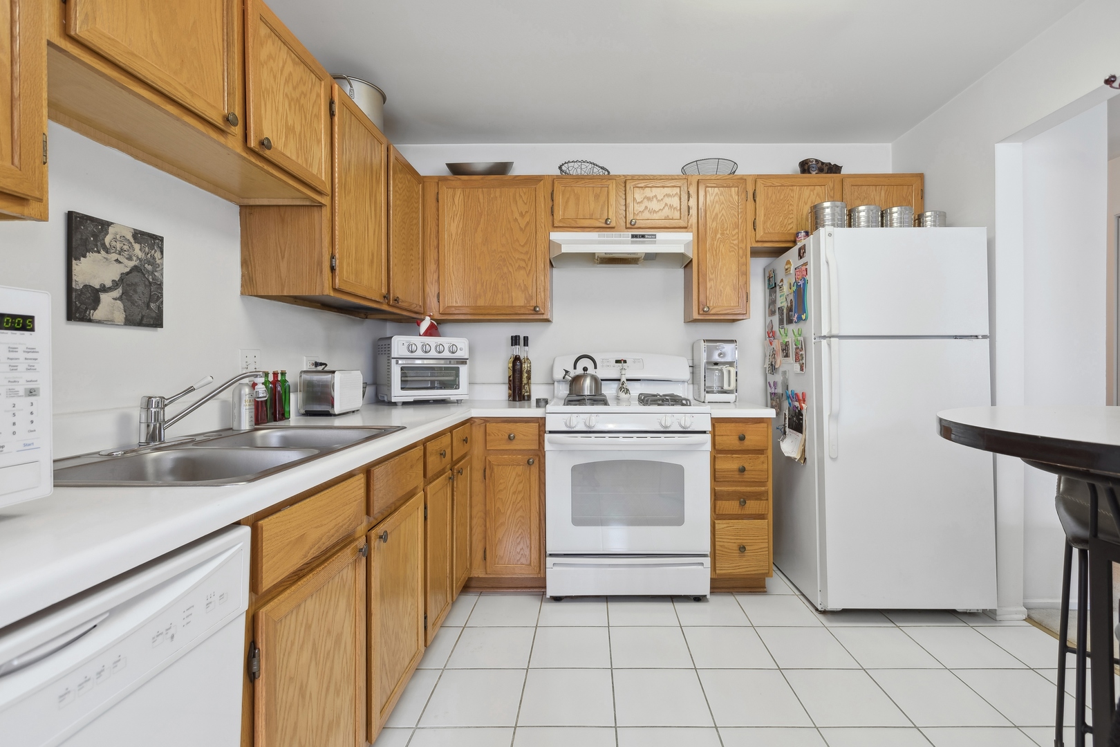 71 Larch Court, Unit B Schaumburg, IL 60193 - Photo 6 of 12 a kitchen with a sink appliances and cabinets