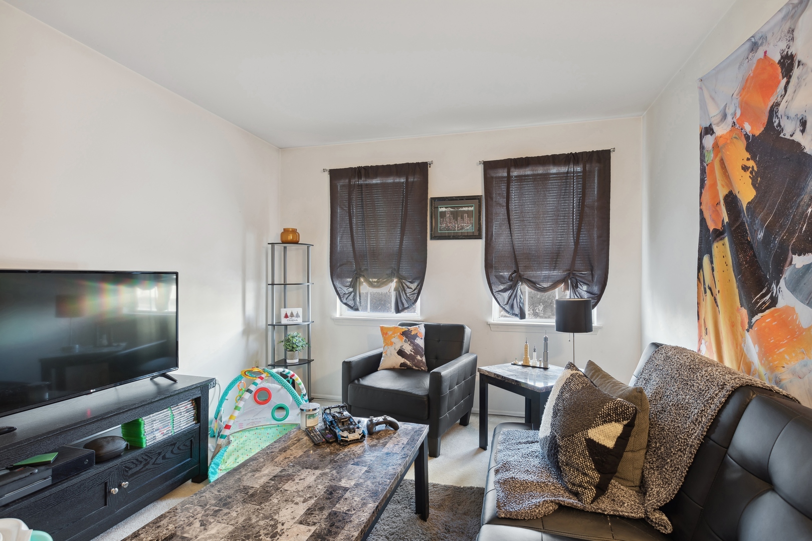 71 Larch Court, Unit B Schaumburg, IL 60193 - Photo 9 of 12 a living room with furniture and a flat screen tv