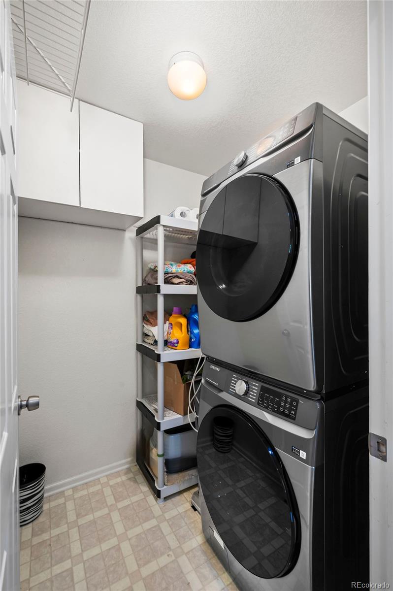 4570 South Swadley Court Morrison, CO 80465 - Photo 17 of 24 a utility room with sink dryer and washer