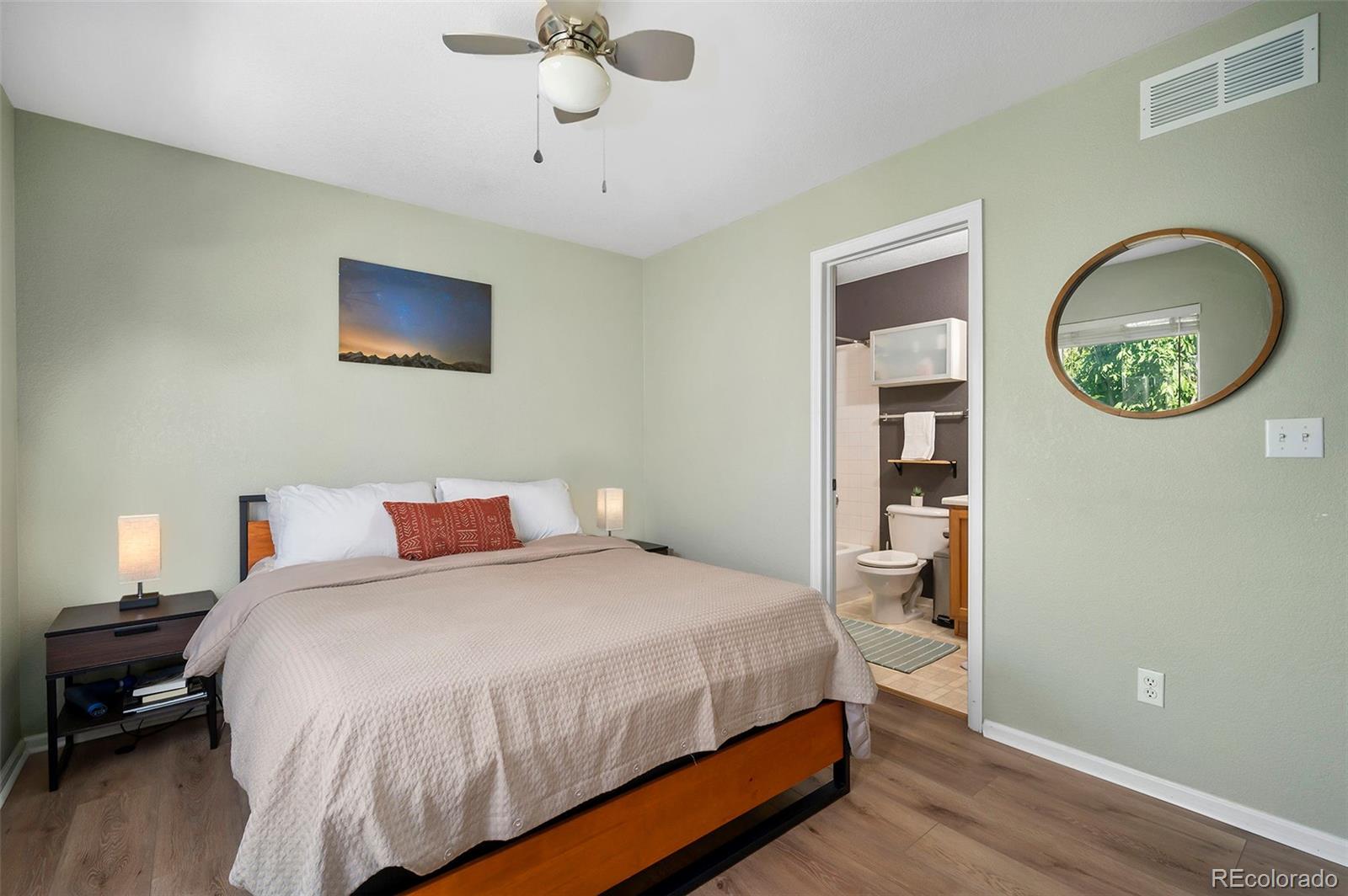 4570 South Swadley Court Morrison, CO 80465 - Photo 6 of 24 a bedroom with a bed and a table