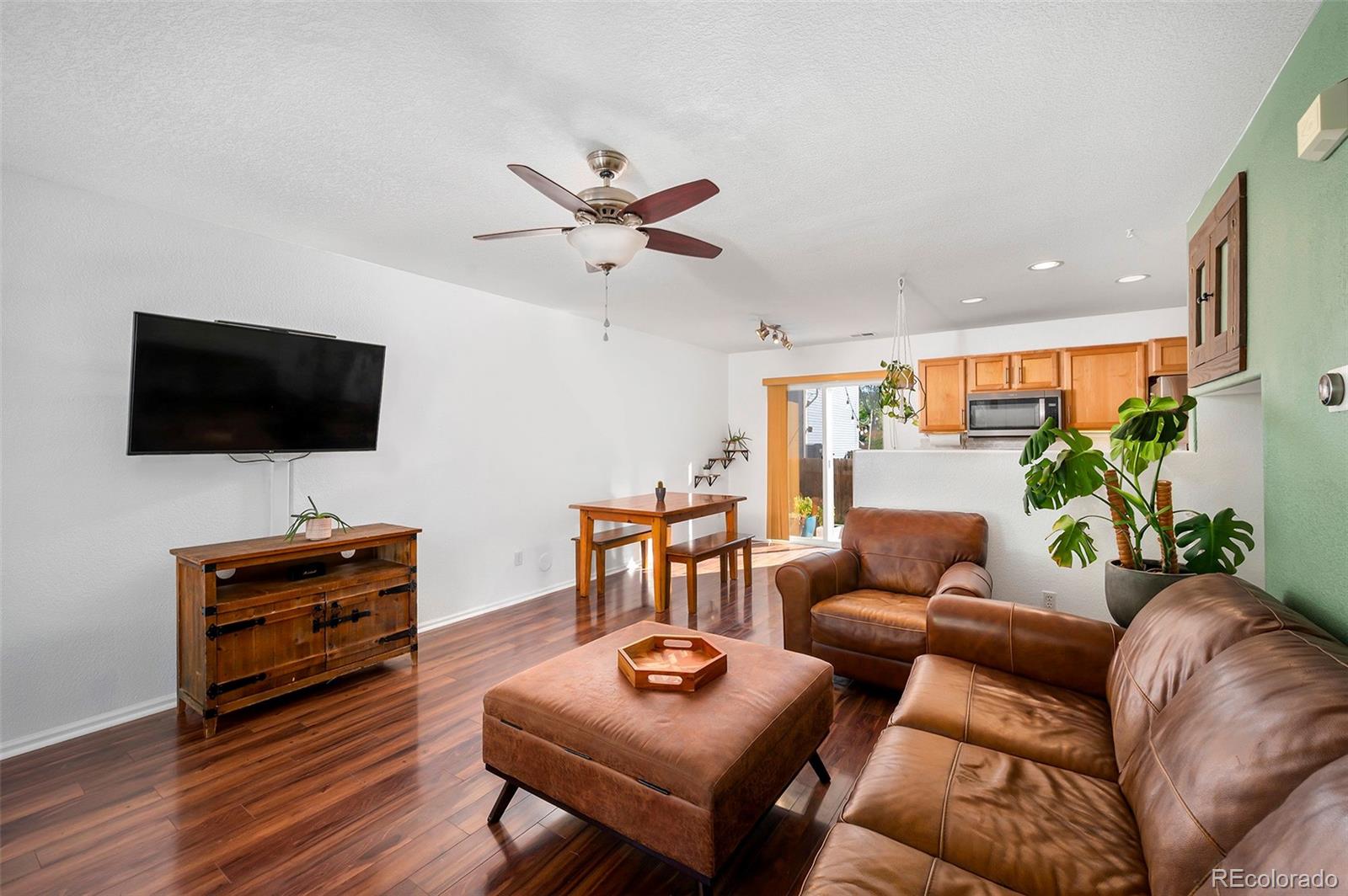 4570 South Swadley Court Morrison, CO 80465 - Photo 10 of 24 a living room with furniture and a flat screen tv