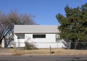 1406 Southwest 46th Avenue Amarillo, TX 79110 - Photo 1 of 7 a view of a house with a yard