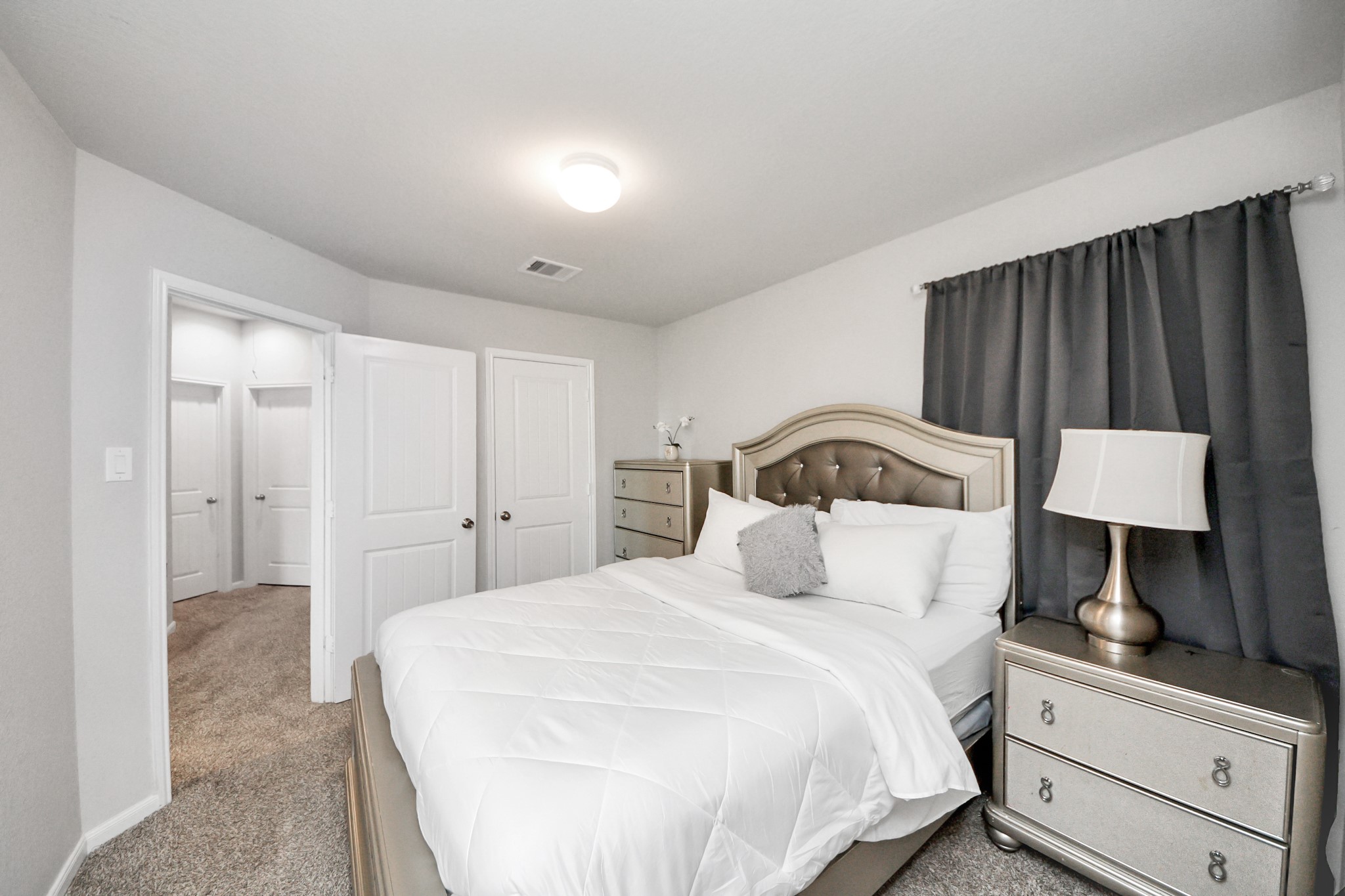 3514 Windham Way Katy, TX 77494 - Photo 16 of 42 a bedroom with a bed and a mirror
