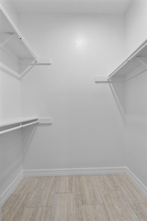 5310 Keller Springs Road, Unit 626 Dallas, TX 75248 - Photo 10 of 13 a view of an empty walk in closet