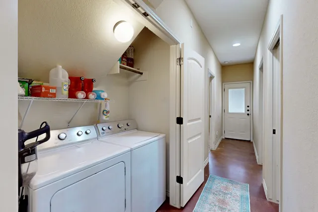 a view of storage and utility room with washer and dryer
