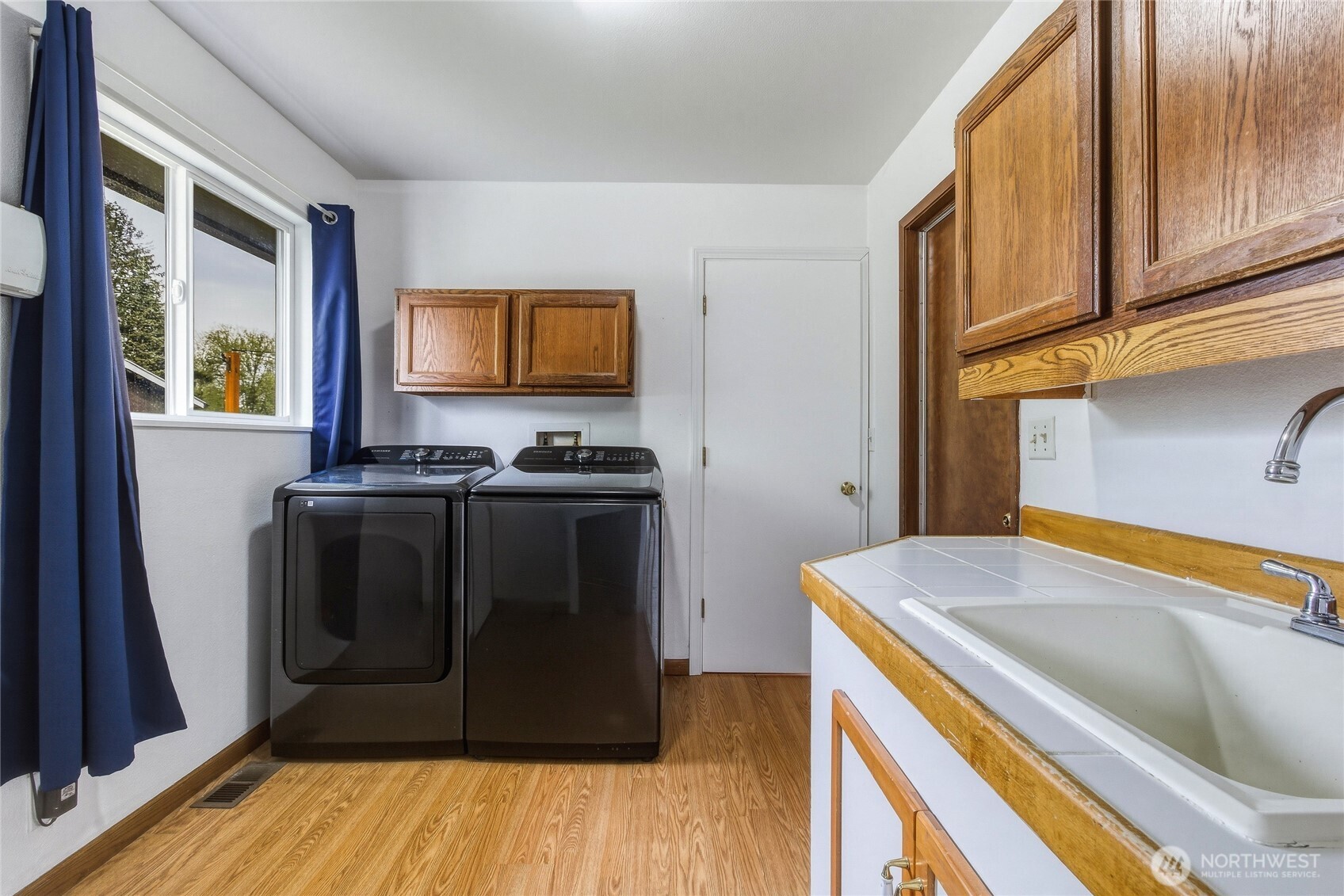304 Southwest 11th Street College Place, WA 99324 - Photo 15 of 38 a kitchen with a stove and a refrigerator