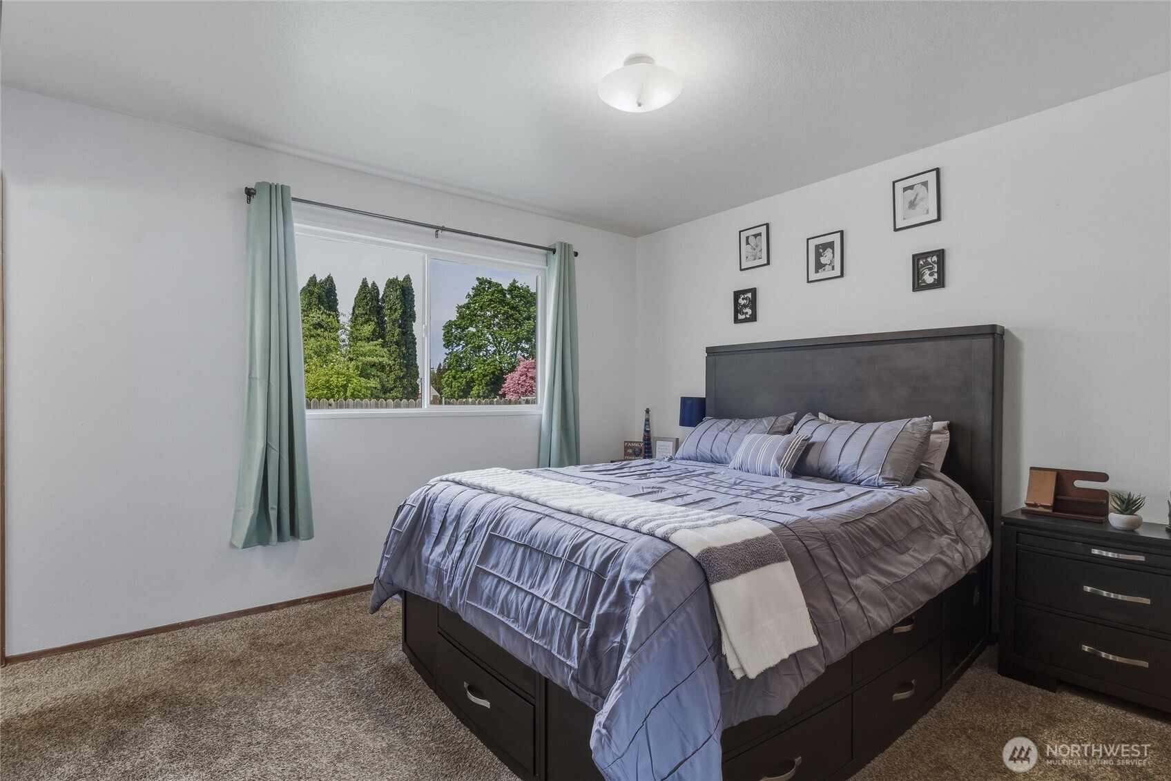 304 Southwest 11th Street College Place, WA 99324 - Photo 18 of 38 a bedroom with a bed and a window
