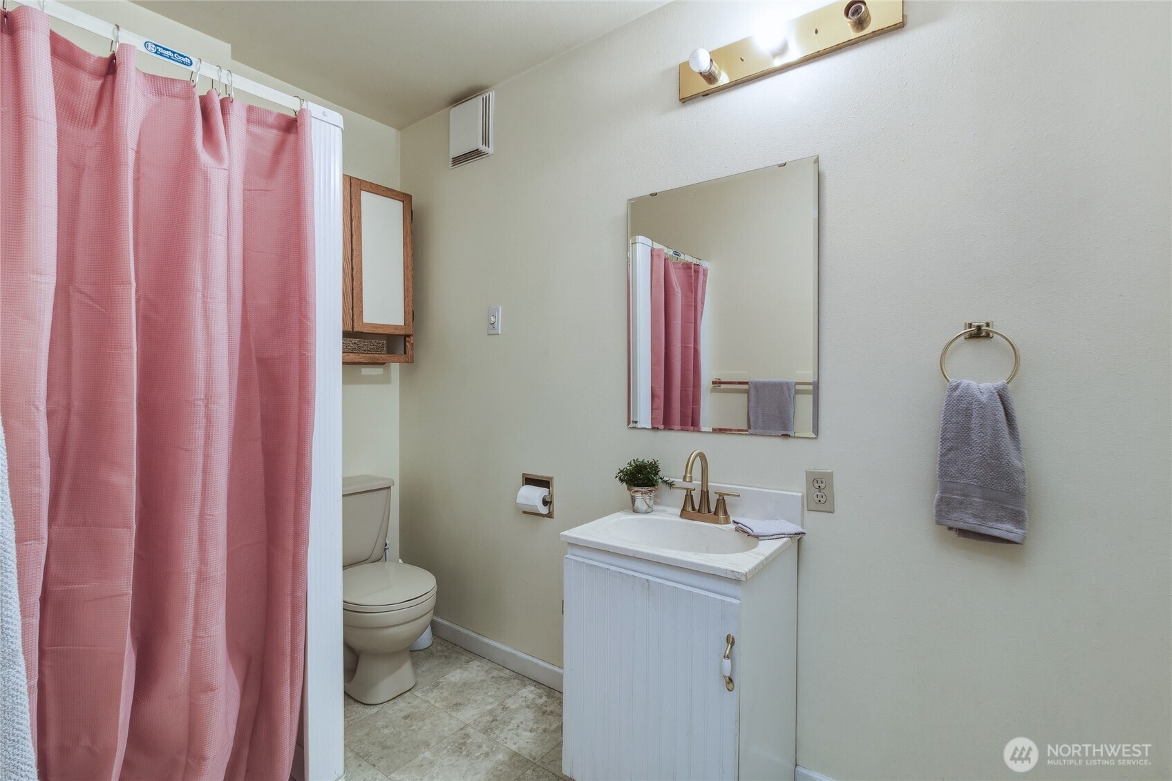 304 Southwest 11th Street College Place, WA 99324 - Photo 32 of 38 a bathroom with a sink a toilet and a mirror