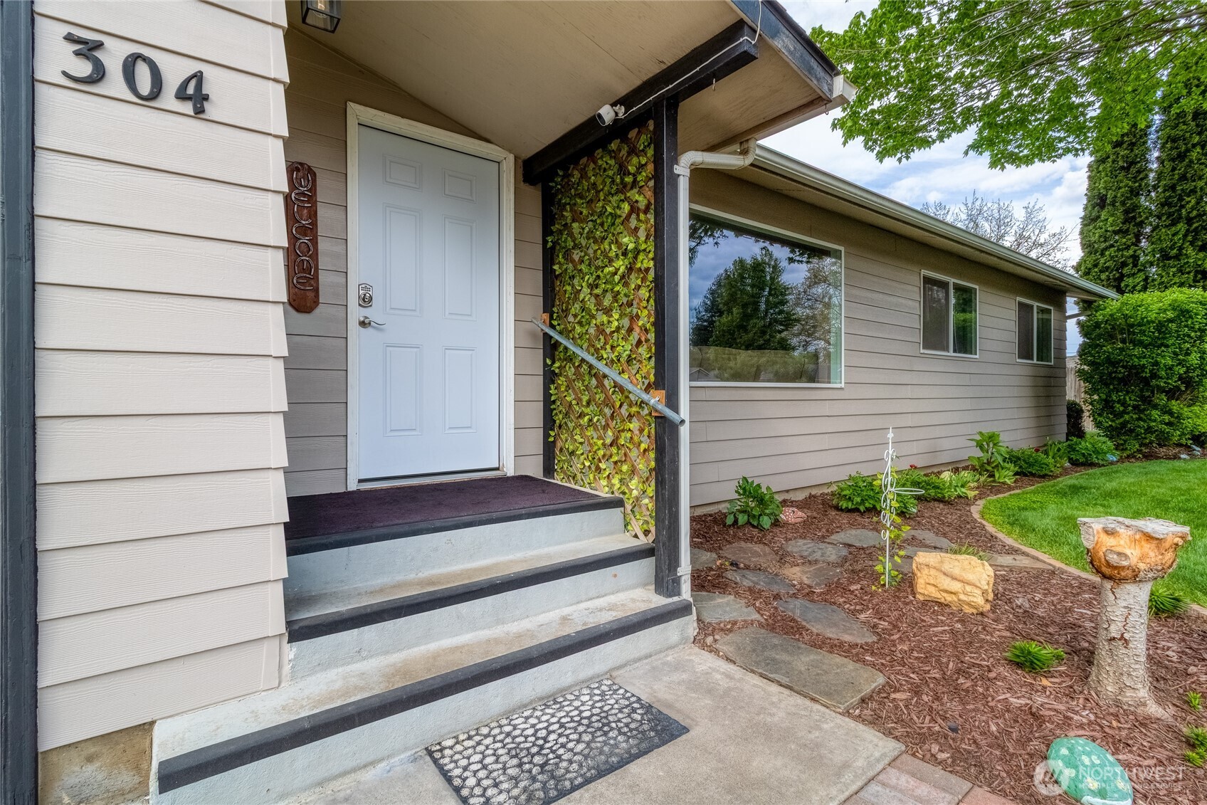 304 Southwest 11th Street College Place, WA 99324 - Photo 38 of 38 a view of house with wooden floor and potted plants