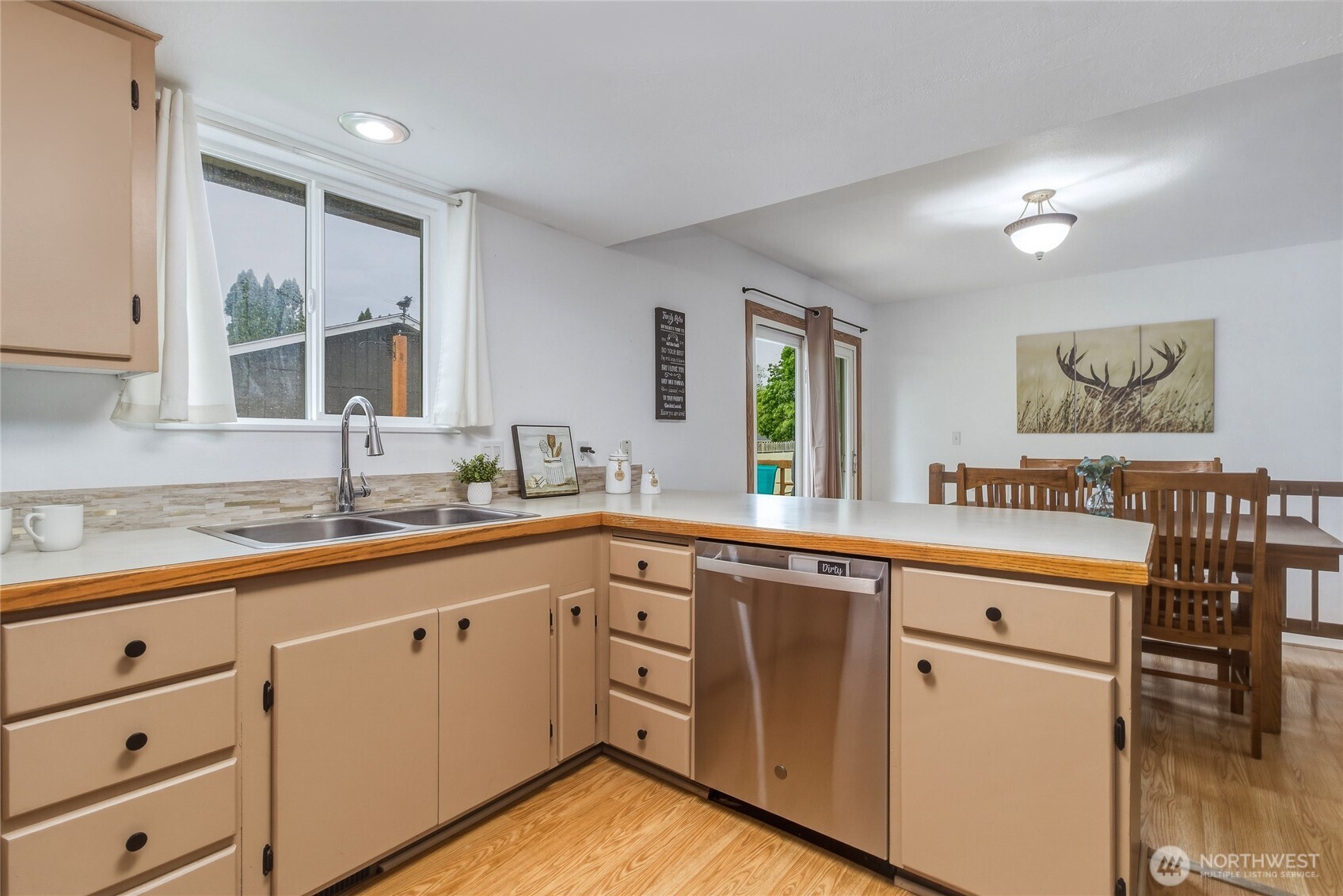 304 Southwest 11th Street College Place, WA 99324 - Photo 10 of 38 a kitchen with cabinets a sink and appliances