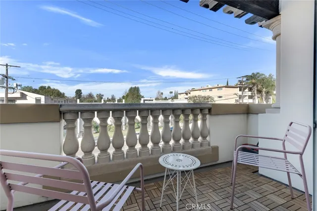 a view of a chairs and table on the terrace