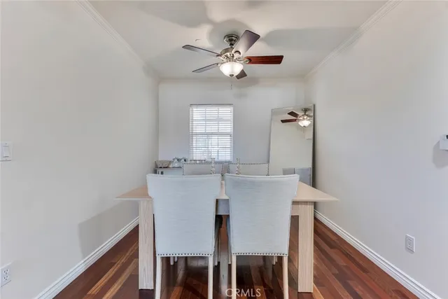 a view of a dining room with furniture and window