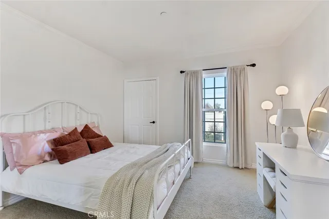 a bedroom with a bed and a cabinets