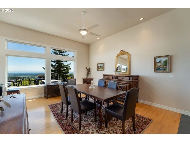 a view of dining room and kitchen with furniture and large window