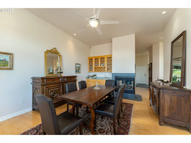 a view of a dining room with furniture and chandelier