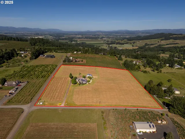 an aerial view of a residential houses with outdoor space