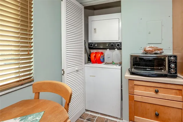a kitchen with stainless steel appliances a stove and a microwave
