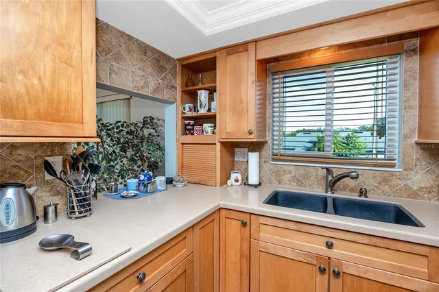 a kitchen with a sink and a window